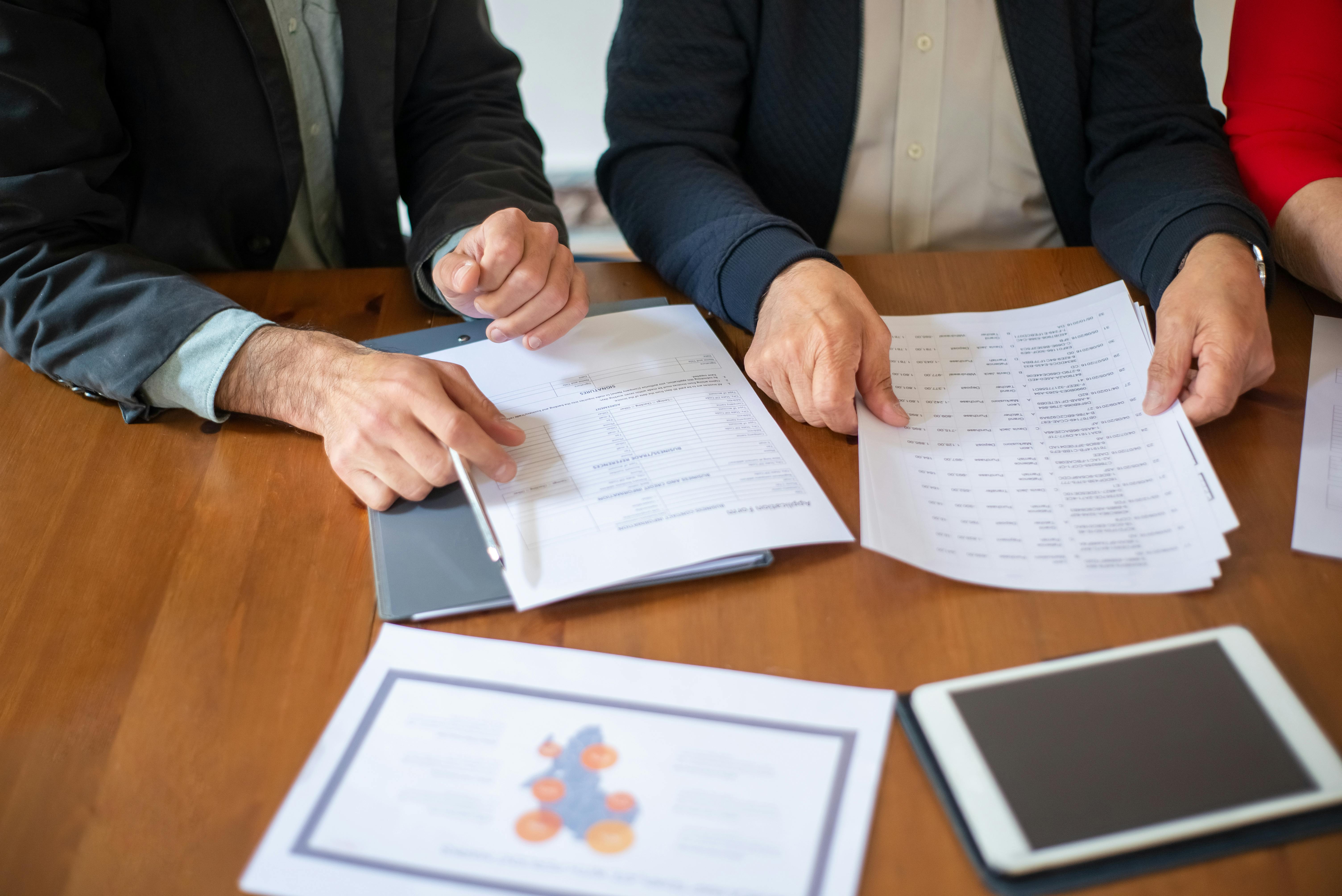 Business team reviewing documents during a meeting.
